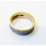 An 18ct. two colour gold band