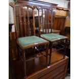 A pair of Edwardian inlaid stained beech framed bedroom chairs with pierced lath backs and