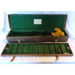 A Victorian leather and mahogany shotgun case with fully fitted and baize lined interior including