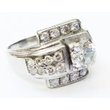 A marked 14k white metal multi diamond designer ring