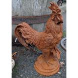 A cast iron cockerel with rust finish