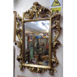 A 36" antique style Italian gilt acanthus scroll framed bevelled oblong wall mirror