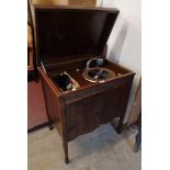 A 1930's 'May Fair De Luxe' polished oak cabinet gramophone with storage to top and cupboard doors