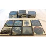 Forty early 20th Century coloured and monochrome pictorial glass slides from various series
