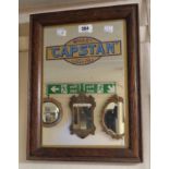 A vintage stained oak framed public house advertising mirror for Wills Capstan Cigarettes