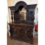 A 4' 11" Victorian carved and stained oak sideboard with break arched pediment, bevelled arched