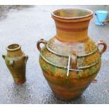 A 32" Mediterranean terracotta oil jar with banded decoration to flared neck and four loop handles -