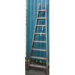 A vintage wooden decorator's trestle ladder