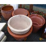 Seven assorted large terracotta and other plant pots