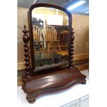 A 27 1/2" Victorian mahogany platform dressing mirror with arched plate, barley twist supports and