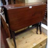 An Edwardian walnut Sutherland table, set on slatted standard ends