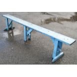 A 7' 11" blue painted pine bench, set on bracketed supports