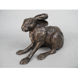 A CONTEMPORARY BRONZE FIGURE OF A SEATED HARE, its ears lying flat towards its back, unmarked,