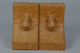 A PAIR OF ROBERT THOMPSON 'MOUSEMAN' OF KILBURN OAK BOOKENDS, each carved with a mouse to the