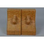 A PAIR OF ROBERT THOMPSON 'MOUSEMAN' OF KILBURN OAK BOOKENDS, each carved with a mouse to the