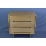 JOHN & SYLVIA REID LIGHT OAK CHEST OF THREE LONG DRAWERS, on raised rounded tapering legs,