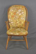 AN ERCOL ELM AND BEECH SPINDLE BACK WINDSOR ARMCHAIR, with original floral cushions to seat and