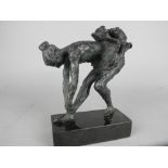 A BRONZE SCULPTURE OF A BALLET DANCER ON A BLACK SLATE BASE, unmarked, height approximately 17cm