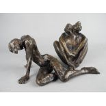 A CONTEMPORARY BRONZE SCULPTURE OF A NUDE FEMALE FIGURE, in a semi recumbant position, unmarked,