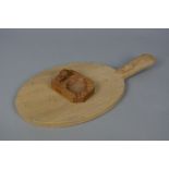 A ROBERT THOMPSON 'MOUSEMAN' OF KILBURN OAK OVAL CHEESE BOARD, the mouse carved to the handle,