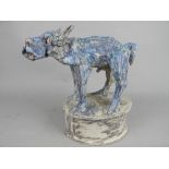 IAN GREGORY (BRITISH B.1942), a stoneware figure of a male dog, modelled as standing on an oval