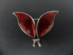 A WILLY WINNAESS FOR DAVID-ANDERSEN, a Norwegian silver and red enamel double leaf brooch, marked,