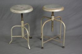 AN INDUSTRIAL MACHINIST STYLE SWIVEL STOOL, on four legs united by stretcher and a similar stool