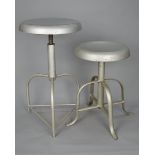 A PAIR OF INDUSTRIAL MACHINIST STYLE SWIVEL STOOLS, on triple legs (2)