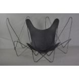 A METAL FRAMED BUTTERFLY STYLE CHAIR, with removable upholstery and two spare frames (3)