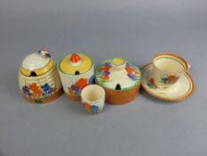 A COLLECTION OF CLARICE CLIFF CROCUS PATTERN WARES, comprising two circular preserve pots and