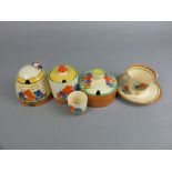 A COLLECTION OF CLARICE CLIFF CROCUS PATTERN WARES, comprising two circular preserve pots and