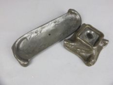 A 20TH CENTURY SWEDISH PEWTER PEN TRAY AND MATCHING INKWELL, cast as fishing in a fast current of