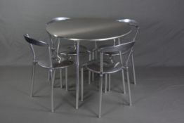 AN ALLERMUIR LUNA CIRCULAR CHROME DINING TABLE, approximate diameter 94cm and four matching
