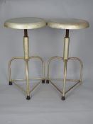 AN INDUSTRIAL MACHINIST STYLE SWIVEL STOOL, on triple legs and a similar stool on four legs (2)