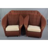 A MID 20TH CENTURY THREE PIECE LOUNGE SUITE, comprising of a three seater settee and a pair of