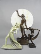 AN ART DECO STYLE PLASTER FIGURE OF A SCANTILY CLAD FEMALE, on a serpentine shaped base, green