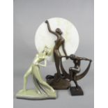 AN ART DECO STYLE PLASTER FIGURE OF A SCANTILY CLAD FEMALE, on a serpentine shaped base, green