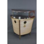 A 1950'S COCKTAIL BAR, formed as a ship on three raised tapering legs with electrical wiring,