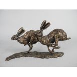 PAUL JENKINS (BRITISH B.1949), RUNNING HARES, a bronze sculpture of two hares, signed to top of