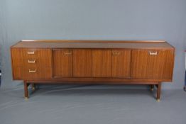 G-PLAN TOLA TEAK SIDEBOARD, with double central sliding doors, flanked by three drawers and fall