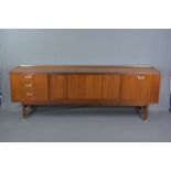 G-PLAN TOLA TEAK SIDEBOARD, with double central sliding doors, flanked by three drawers and fall