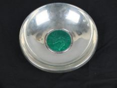 A NORWEGIAN 830 SILVER AND ENAMEL CIRCULAR DISH, the centre in green enamel with man fly fishing,