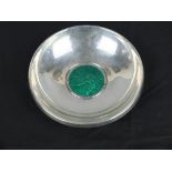 A NORWEGIAN 830 SILVER AND ENAMEL CIRCULAR DISH, the centre in green enamel with man fly fishing,