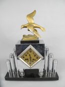 AN ART DECO CHROME CASED MANTEL CLOCK, gilt metal figure of a seagull flying above water on a