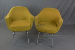 A PAIR OF TANSAD ARMCHAIRS, with downswept shaped arms on chrome legs, approximate width arm to