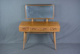 AN ERCOL ELM DRESSING TABLE, with rectangular mirror back, two short and one long frieze drawers, on