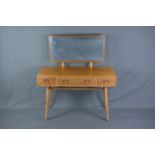 AN ERCOL ELM DRESSING TABLE, with rectangular mirror back, two short and one long frieze drawers, on