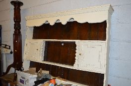 A PAINTED OAK BARLEY TWIST PLATE RACK, with two doors either side of shelves and a carved mahogany