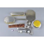 A FOUR PIECE SILVER DRESSING SET, a silver and enamelled glass pot, three spoons, napkin ring and