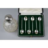 A CASED SILVER COFFEE SPOON SET, and a silver topped scent bottle